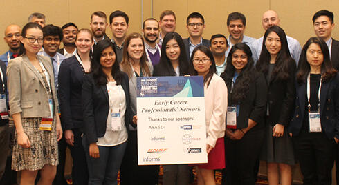 The attendees of the Early Career Professionals' Network event standing together and smiling for a group photo